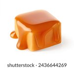 One beautiful sweet caramel candy cube topped with caramel sauce isolated on white background