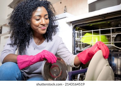 One Black Woman Checking Broken Dishwasher At Home