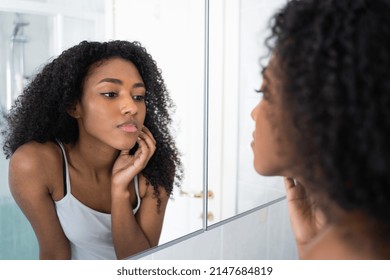 One Black Woman Looking Skincare Mirror