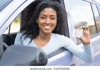 One Black Woman Very Happy Exhibits Her Drive License