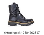 One black worn ankle leather combat boot with thick, sturdy sole and laces. Single vintage military style shoe. Studio light. Isolated on white background. Empty copy space. Clipping path