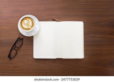 One blank open page note book and coffee cup on wooden table top. - Powered by Shutterstock