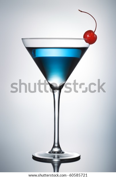 One blue cocktail martini with cherry (pen clip\
path included)