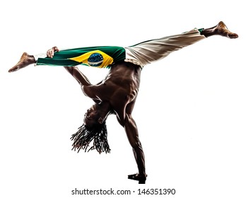 one brazilian  black man dancer dancing capoiera on white background