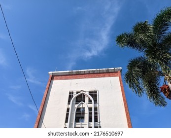 One Of The Buildings Of The North Sumatra State Islamic University With A Blue Sky Decoration And Areca Nut Trees. Medan Indonesia June 2022