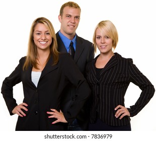 One Business Man In Between Two Attractive Confident Business Women Both Wearing Dark Colored Business Suits All Smiling Standing On White Background