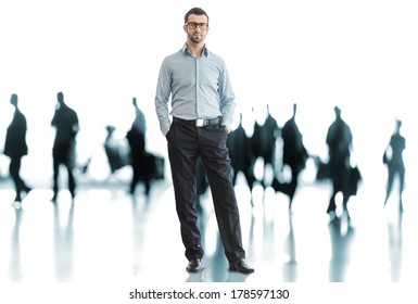 One Business Man Standing In Front Of Crowd