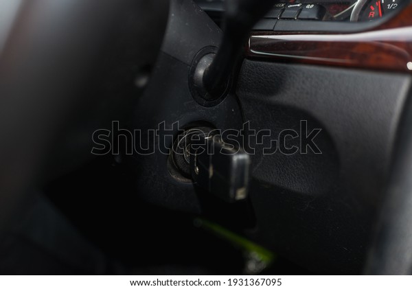 One Car\
key in an auto ignition waiting for a\
driver.