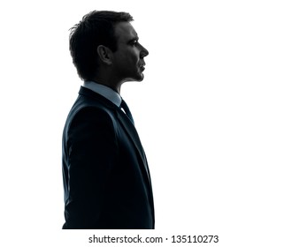 One Caucasian Business Man Serious Portrait Profile   In Silhouette Studio Isolated On White Background