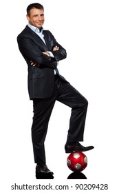 One Caucasian Business Man Standing Arms Crossed Foot On Soccer Ball In Studio Isolated On White Background