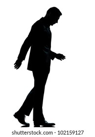 One Caucasian Business Man Walking Silhouette Full Length In Studio Isolated On White Background