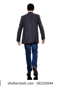 one caucasian business man walking rear view  in silhouette  on white background