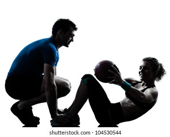 One Caucasian Couple Man Woman Personal Trainer Coach Exercising Weights Fitness Ball Silhouette Studio Isolated On White Background