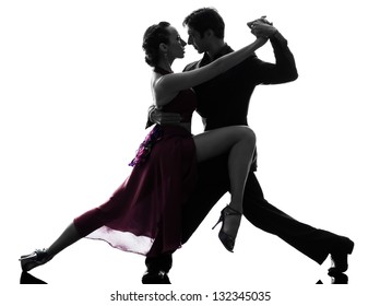 One Caucasian Couple Man Woman Ballroom Dancers Tangoing  In Silhouette Studio Isolated On White Background