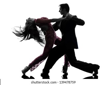 one caucasian couple man woman ballroom dancers tangoing  in silhouette studio isolated on white background