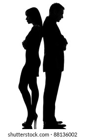 one caucasian couple standing back to back dispute conflict  man and woman sad in studio silhouette isolated on white background