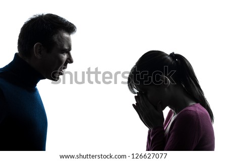 one caucasian couple woman man dispute    in silhouette studio isolated on white background