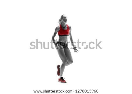 Similar – One young middle age athletic, woman training, exercising with fitness jumping rope over dark background, full length front view, looking at camera