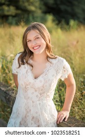 One Caucasian High School Senior Girl In White Romper