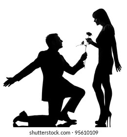 One Caucasian Lovers Couple Man Kneeling Offering Rose Flower And Woman In Studio Silhouette Isolated On White Background