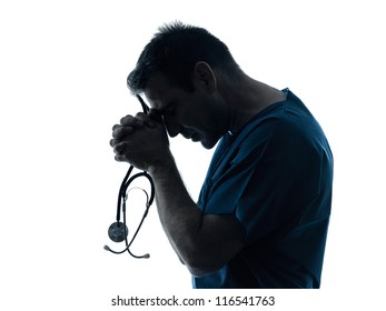 One Caucasian Man Doctor Surgeon Medical Worker Praying Silhouette Isolated On White Background