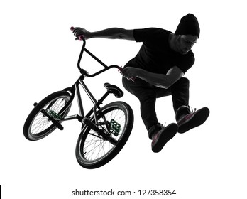 One Caucasian Man Exercising Bmx Acrobatic Figure In Silhouette Studio Isolated On White Background