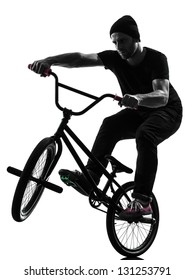 One Caucasian Man Exercising Bmx Acrobatic Figure In Silhouette Studio Isolated On White Background