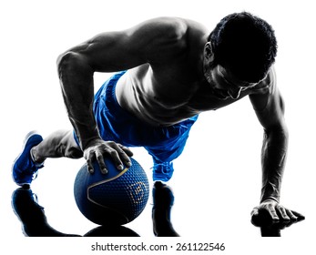 one caucasian man exercising fitness weights Medicine Ball push ups exercises in studio silhouette isolated on white background - Powered by Shutterstock