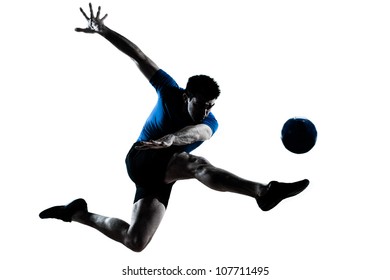 one caucasian man flying kicking playing soccer football player silhouette  in studio isolated on white background - Powered by Shutterstock