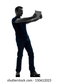 One Caucasian Man Holding Watching Digital Tablet   In Silhouette On White Background