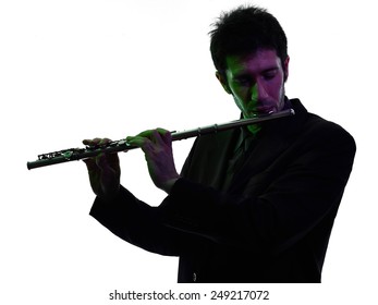 One Caucasian Man  Playing Traverse Flute Player In Studio Silhouette Isolated On White Background