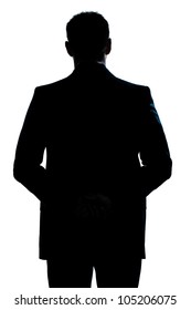 One Caucasian Man Portrait Silhouette Backside Standing Hands Behind Back In Studio Isolated White Background