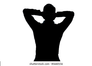 one caucasian man portrait silhouette stretching resting hands behind head in studio isolated white background - Powered by Shutterstock