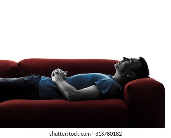 One Caucasian Man Sofa Couch Sleeping In Silhouette Isolated On White Background