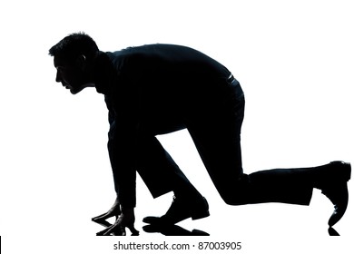 One Caucasian Man In Starting Block Posture Ready To Run Full Length Silhouette In Studio Isolated White Background