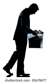 One Caucasian Man Walking  Full Length Fired Carrying Heavy Box Silhouette In Studio Isolated White Background