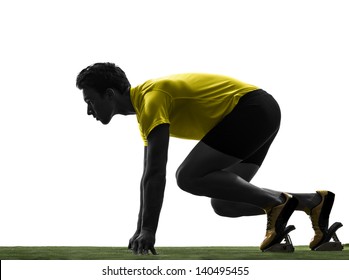 One Caucasian Man Young Sprinter Runner  In Starting Blocks  Silhouette Studio  On White Background