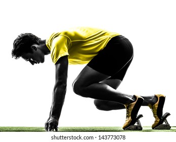 One Caucasian Man Young Sprinter Runner  In Starting Blocks  Silhouette Studio  On White Background