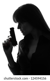 One Caucasian Sexy Detective  Woman Holding  Gun In Silhouette Studio Isolated On White Background