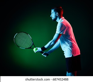 One Caucasian Tennis Player Man Studio Isolated On Black Background