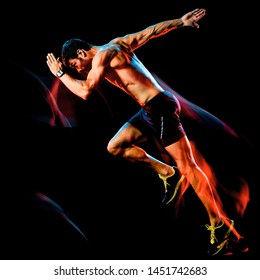 One Caucasian Topless Muscular Mature Man Runner. Running Jogger Jogging Isolated On Black Background With Light Painting Speed Mouvement Effect