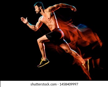 One Caucasian Topless Muscular Mature Man Runner. Running Jogger Jogging Isolated On Black Background With Light Painting Speed Mouvement Effect