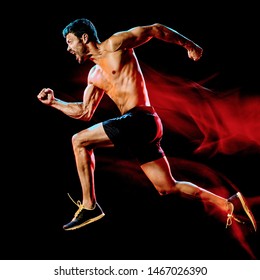 One Caucasian Topless Muscular Mature Man Runner. Running Jogger Jogging Isolated On Black Background With Light Painting Speed Mouvement Effect