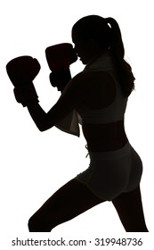 one caucasian woman boxing exercising in silhouette studio isolated on white background