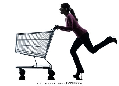 one caucasian woman with empty shopping cart in silhouette studio isolated on white background