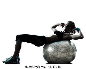 one caucasian woman exercising fitness ball workout posture in silhouette studio isolated on white background