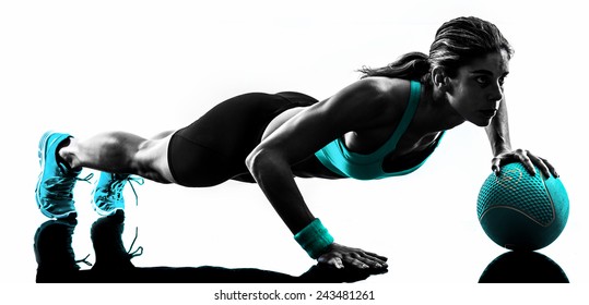 one caucasian woman exercising Medicine Ball  fitness in studio silhouette isolated on white background