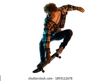 one caucasian young man skateboarder Skateboarding in studio silhouette shadow isolated on white background