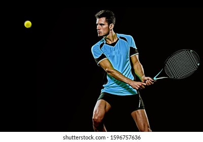 One Caucasian Young Player Tennis Man In Studio Isolated On Black Background