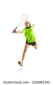 The One Caucasian Young Teenager Girl Playing Badminton At Studio. The Female Teen Player Isolated On White Background In Motion